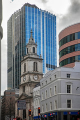 Fototapeta na wymiar St Botolph-without-Bishopsgate, busy exterior set against modern offices LONDON, UNITED KINGDOM, Architect