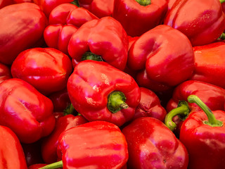 Red peppers stacked in a market