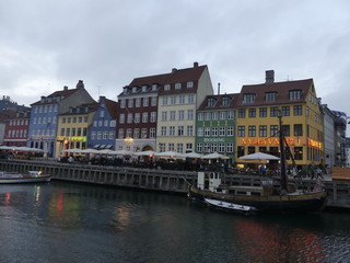 Fototapeta na wymiar View of Nyhavn. Boats stand on the Nyhavn pier in the city center.
