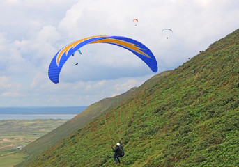 Paragliders flying at Rhossili, Wales