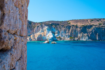 Crystal clear turquoise waters of the bay of Firopotamos village in Milos, Cyclades, Greece