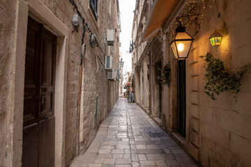 Fototapeta na wymiar Dubrovnik, Croatia - april 2019: Old City of Dubrovnik. One of many narrow streets of medieval town