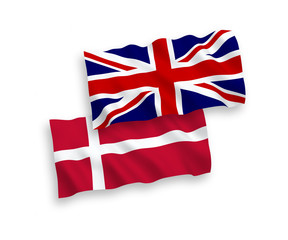 National vector fabric wave flags of Great Britain and Denmark isolated on white background. 1 to 2 proportion.