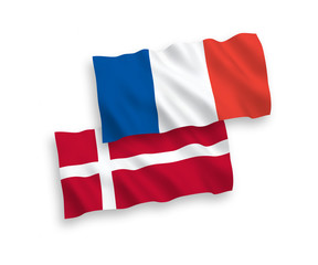 National vector fabric wave flags of France and Denmark isolated on white background. 1 to 2 proportion.