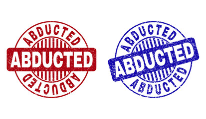 Grunge ABDUCTED round stamp seals isolated on a white background. Round seals with distress texture in red and blue colors. Vector rubber watermark of ABDUCTED text inside circle form with stripes.