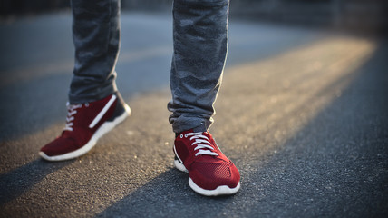 Close up of man, red sneakers on street