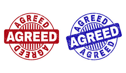 Grunge AGREED round stamp seals isolated on a white background. Round seals with distress texture in red and blue colors. Vector rubber imprint of AGREED caption inside circle form with stripes.