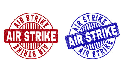 Grunge AIR STRIKE round stamp seals isolated on a white background. Round seals with grunge texture in red and blue colors. Vector rubber watermark of AIR STRIKE label inside circle form with stripes.