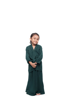 Malay girl posing with baju kurung, a traditional dress