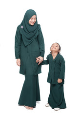 Malay mother and daughter in traditional dress posing