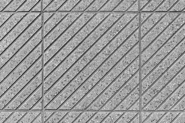 Road tiles with a pattern of inclined strips of gray