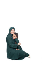 Malay mother and daughter in traditional dress posing