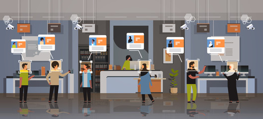 mix race customers choosing digital devices identification facial recognition concept modern electronics store shop interior security camera surveillance cctv system horizontal full length