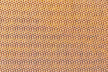Corrugated steel sheet with rust. Rhombic pattern
