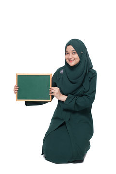 Malay woman wearing hijab with blank black board