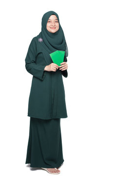 Malay woman holding green money packet.