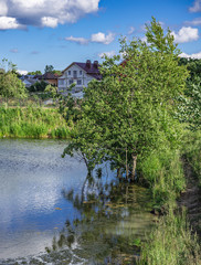 Fototapeta na wymiar Landscape with a lake in the countryside