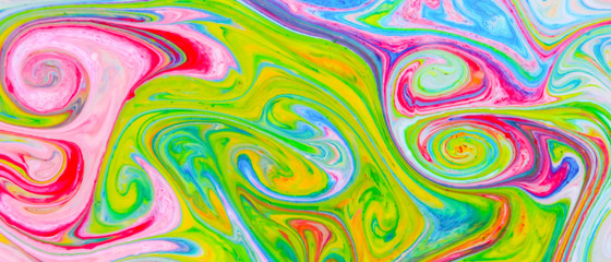 Fluid art with different colors. Screen saver. Multicolored background from paints on liquid. Bright pattern on liquid. Colored paint stains in pop art style