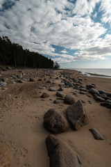 Veczemju Klintis - Boulder beach in Baltic country Latvia in April 2019 - Cloudy sky with dull clouds and a bit of sun