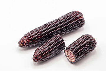 Siam ruby queen corn on isolate white background.It can eat as a fresh,steam,grill,and microwave.Sweet red corn of Thailand.