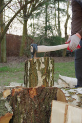 Chopping wood with axe