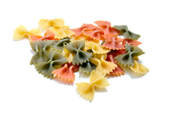 Farfalle tricolore. Heap of uncooked traditional italian pasta isolated on a white background