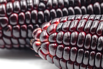Siam ruby queen corn on isolate white background.It can eat as a fresh,steam,grill,and microwave.Sweet red corn of Thailand.
