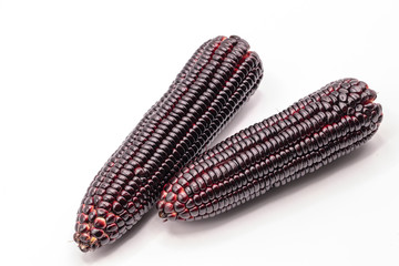 Siam ruby queen corn on isolate white background.It can eat as a fresh,steam,grill,and microwave.Sweet red corn of Thailand.
