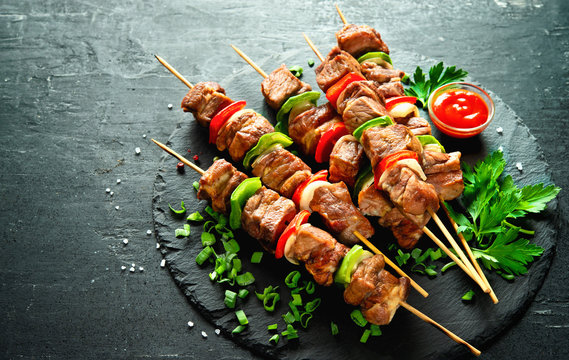 Grilled meat and vegetables on skewers
