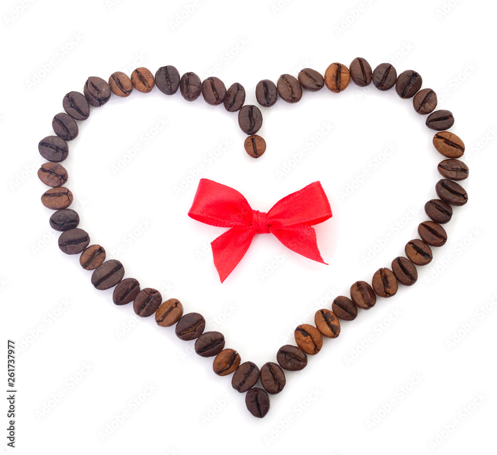 Wall mural coffee beans in the shape of a heart with a bow.