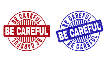 Grunge BE CAREFUL round stamp seals isolated on a white background. Round seals with grunge texture in red and blue colors.