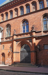 Fototapeta na wymiar Old European red brick building facade.