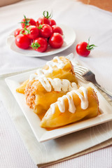 Stuffed pepper with meat and rice on a white square plate