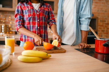 Black love couple cooking romantic dinner
