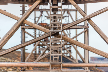 Look through he old cableway for transporting coal from mines in Longyearbyen, Svalbard, Spitsbergen, Norway