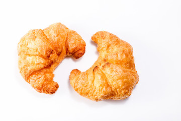 Croissant. Fresh and tasty croissants isolated on a white background, top view, space for text