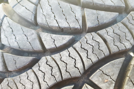 Close-up winter tire tread. Textured tire tread. Part of brand new modern winter car tire.