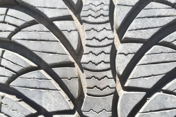 Close-up winter tire tread. Textured tire tread. Part of brand new modern winter car tire.