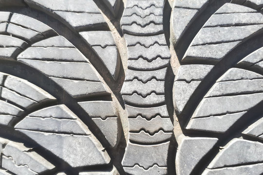 Close-up winter tire tread. Textured tire tread. Part of brand new modern winter car tire.