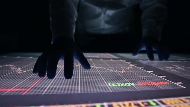 Man indicators on sensor touch screen sensory interactive table in the dark. 