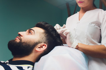 Treatment of baldness with beauty injections. Mesotherapy. Plasma lifting.