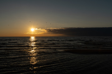 Vivid sunset with very low sun on the Baltic Sea - Red colors - Tuja, Latvia - April 13, 2019