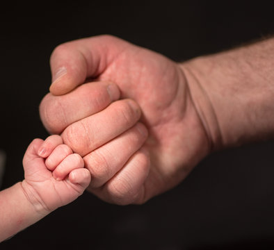 Adult,baby,background,black,blurry,body,body Part,bump,business,care,child,child Rearing,close,close Up,closeup,color,family,finger,fist,greeting,grow,hand,happiness,hold,human,infants,isolated,kid,