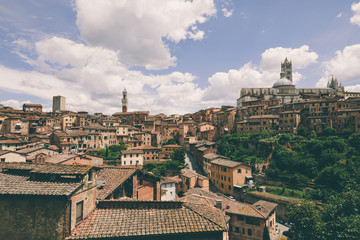 Panoramic view of Siena city with historic buildings and street