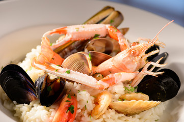 Rice with seafood on a plate in restauant ready to be served