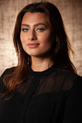 Fototapeta premium BBeauty portrait of cute brunette woman with blue eyes over grunge brown background