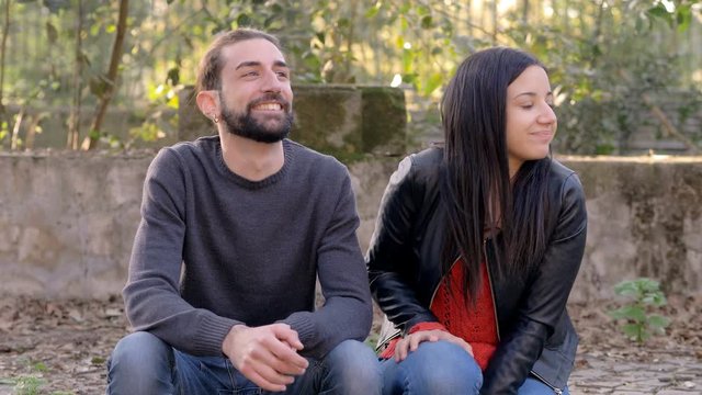 flirt,attraction,shyness.shy young woman embarrassing when man kisses her