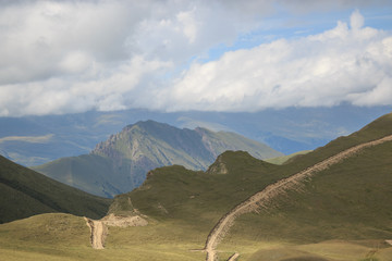 Panorama of road in mountains ofnational park Dombay, Caucasus