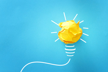 concept image of successful idea, crumpled paper and light bulb sketch, brainstorming and creative...