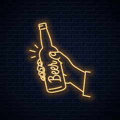Hand hold beer bottle neon sign. Male a beer © Pushkarevskyy